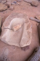 009:  Grinding stone for making corn meal.